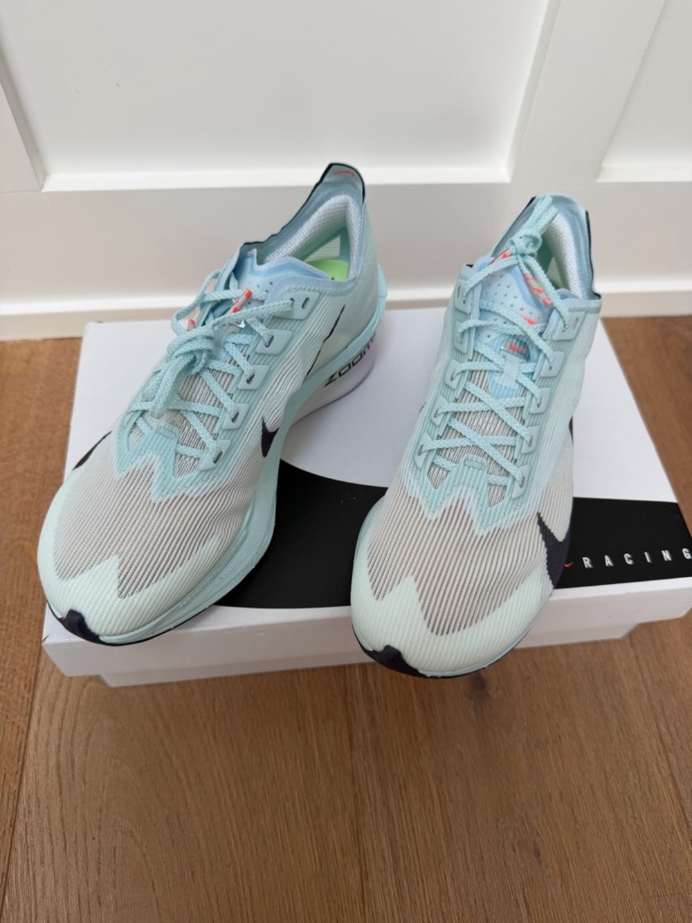 Nike Women’s Athletic Running Shoes in Light Aqua with Black Swoosh